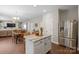 Open concept kitchen and dining area with stainless steel appliances, kitchen island, and dining table at 10241 Barrands Ln, Charlotte, NC 28278