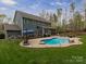Backyard featuring a large swimming pool, patio, outdoor seating and green grass at 1041 Crofton Dr, Waxhaw, NC 28173