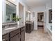 Bathroom featuring double vanity with granite countertop and tiled floor at 1041 Crofton Dr, Waxhaw, NC 28173