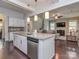 Spacious kitchen with an island, stainless steel appliances, and an open layout, connecting seamlessly to the living room at 1041 Crofton Dr, Waxhaw, NC 28173