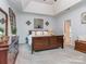 Comfortable main bedroom features a tray ceiling, ceiling fan, and neutral color scheme at 1041 Crofton Dr, Waxhaw, NC 28173