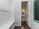 Mudroom with bench seating and coat hooks, leads to a half bathroom at 1041 Crofton Dr, Waxhaw, NC 28173