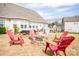 Inviting backyard with a fire pit and adirondack chairs, great for outdoor entertaining at 118 Heathrow Ln, Statesville, NC 28677