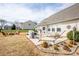 The backyard patio area has a hammock, grill, and is surrounded by landscaping at 118 Heathrow Ln, Statesville, NC 28677
