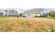 Expansive backyard featuring a well-maintained lawn and patio area, perfect for outdoor activities at 118 Heathrow Ln, Statesville, NC 28677