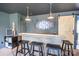Stylish bar area in finished basement with modern lighting, wooden bar, and comfortable seating at 118 Heathrow Ln, Statesville, NC 28677