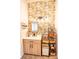 Bathroom with bright floral accent wall, modern vanity, and decorative shelves for storage at 118 Heathrow Ln, Statesville, NC 28677