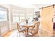 Bright breakfast nook with wood table and four chairs, adjacent to barn door at 118 Heathrow Ln, Statesville, NC 28677