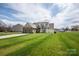 Beautiful home featuring a large front yard, complemented by a driveway and manicured lawn at 118 Heathrow Ln, Statesville, NC 28677