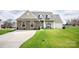 Inviting single-Gathering home with a long driveway and a well-maintained front lawn at 118 Heathrow Ln, Statesville, NC 28677