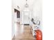 Bright foyer with a stylish console table, light hardwood floors, and a view to the living area at 118 Heathrow Ln, Statesville, NC 28677
