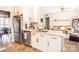 Updated kitchen features stainless appliances and marble countertops with open-concept design at 118 Heathrow Ln, Statesville, NC 28677
