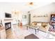 Comfortable living room with a fireplace, wood floors, and an open layout to the foyer at 118 Heathrow Ln, Statesville, NC 28677