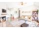Bright and airy living room with a fireplace, wood floors, and comfortable sofa seating at 118 Heathrow Ln, Statesville, NC 28677