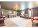 Finished basement featuring a bar, TV, and comfortable seating, perfect for relaxing and entertaining at 118 Heathrow Ln, Statesville, NC 28677
