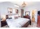 Comfortable main bedroom featuring neutral paint, natural lighting, and a decorative chandelier at 118 Heathrow Ln, Statesville, NC 28677