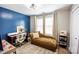 Bright office with a comfortable lounge sofa, desk, and plenty of natural light at 118 Heathrow Ln, Statesville, NC 28677