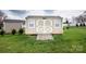 Backyard shed with double doors for additional storage or workspace at 118 Heathrow Ln, Statesville, NC 28677