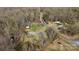 Aerial view of a home with a pool and outbuildings in a wooded area at 119 Old Hearth Rd, Clover, SC 29710