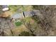 Aerial view of home featuring a pool, firepit, deck and mature landscaping at 119 Old Hearth Rd, Clover, SC 29710
