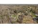 Wide aerial view of a wooded community with several homes and a lake nearby at 119 Old Hearth Rd, Clover, SC 29710