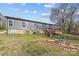 Spacious backyard with fire pit and deck, creating an inviting outdoor space at 119 Old Hearth Rd, Clover, SC 29710