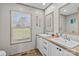 Bright bathroom with dual sinks and wood-look floors for a clean, modern look at 119 Old Hearth Rd, Clover, SC 29710