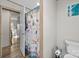 Bathroom with a toilet, patterned shower curtain, and wood-look flooring at 119 Old Hearth Rd, Clover, SC 29710