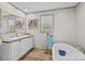 Bright bathroom featuring a vanity with double sinks and a soaking tub at 119 Old Hearth Rd, Clover, SC 29710