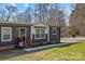 Inviting front entrance featuring a stained wood porch with walkway and attractive landscaping at 119 Old Hearth Rd, Clover, SC 29710