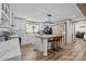 Modern kitchen featuring white cabinets, a center island, and a sliding barn door at 119 Old Hearth Rd, Clover, SC 29710