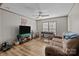 Cozy living room with natural light, ceiling fan, and vinyl floors at 119 Old Hearth Rd, Clover, SC 29710