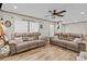 Bright living room featuring two sofas, a ceiling fan, and natural light at 119 Old Hearth Rd, Clover, SC 29710