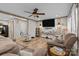 Spacious living room with comfortable seating, a large television, and stylish decor at 119 Old Hearth Rd, Clover, SC 29710