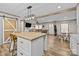 Open-concept living space featuring a kitchen island and a view of the living room at 119 Old Hearth Rd, Clover, SC 29710