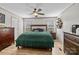 Well-lit main bedroom with neutral walls, ceiling fan, and wood-look floors at 119 Old Hearth Rd, Clover, SC 29710