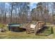 Above-ground pool with wooden deck surround, perfect for summertime fun at 119 Old Hearth Rd, Clover, SC 29710