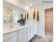Relaxing bathroom features double vanity, spacious countertop, and walk in shower at 12140 Devon Square Ct, Charlotte, NC 28262