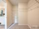 Spacious walk-in closet features wire shelving and ample storage space for organization at 12140 Devon Square Ct, Charlotte, NC 28262