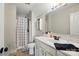 Clean, well-lit bathroom with a shower-tub combo, vanity, and modern fixtures at 1276 Stonecrest Blvd, Tega Cay, SC 29708