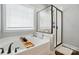 Bright bathroom with soaker tub, walk-in shower and window at 1276 Stonecrest Blvd, Tega Cay, SC 29708