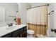 Bathroom featuring a single sink vanity, dark wood cabinets, and a shower with curtain at 1276 Stonecrest Blvd, Tega Cay, SC 29708