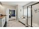 Bathroom featuring a soaker tub, a shower and an entrance into the bedroom at 1276 Stonecrest Blvd, Tega Cay, SC 29708