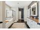 Bright primary bathroom with double sinks, walk-in shower and soaker tub at 1276 Stonecrest Blvd, Tega Cay, SC 29708