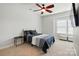 Bedroom with ceiling fan, comfortable bed, and natural light from the window at 1276 Stonecrest Blvd, Tega Cay, SC 29708