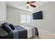 Bedroom featuring a ceiling fan, carpet floors, and a wall-mounted television at 1276 Stonecrest Blvd, Tega Cay, SC 29708