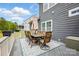 Outdoor deck featuring a stone table with seating and an umbrella for shade at 1276 Stonecrest Blvd, Tega Cay, SC 29708