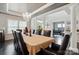 Spacious dining room featuring hardwood floors, chandelier, and open access to a living room at 1276 Stonecrest Blvd, Tega Cay, SC 29708