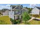 Beautiful home with manicured lawn and landscaping; features an American flag at 1276 Stonecrest Blvd, Tega Cay, SC 29708