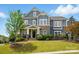 Charming two-story home featuring a landscaped front yard and stone accents at 1276 Stonecrest Blvd, Tega Cay, SC 29708